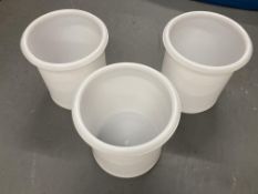 Three larger white plastic tubs