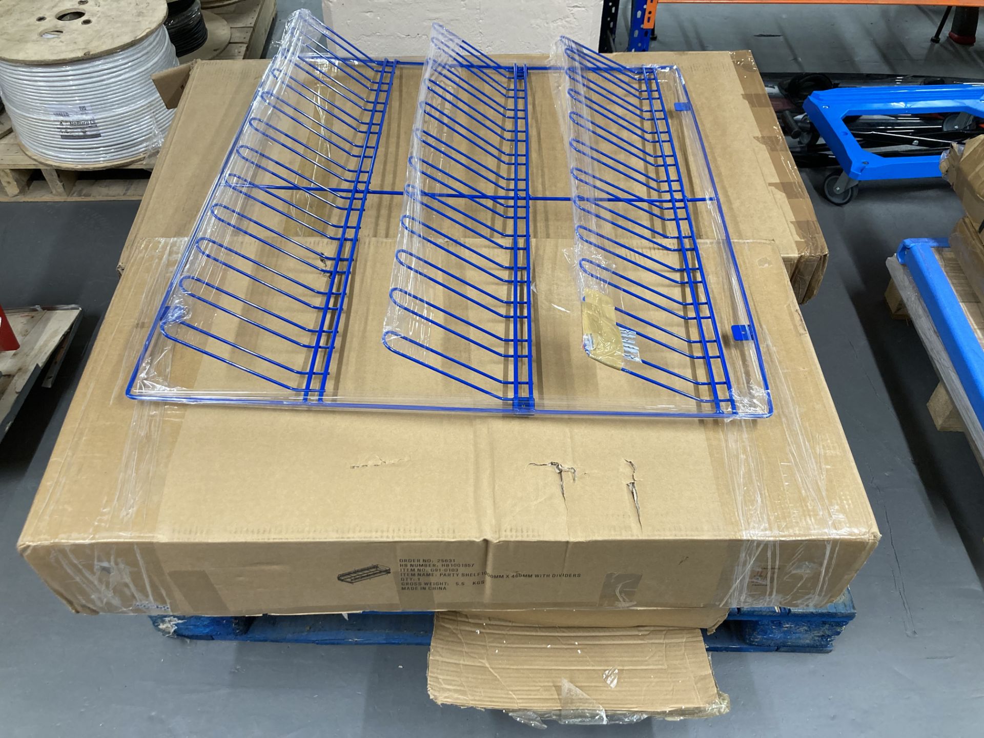 A pallet containing a metal Wellington boot rack and four boxes of flat pack items to include party