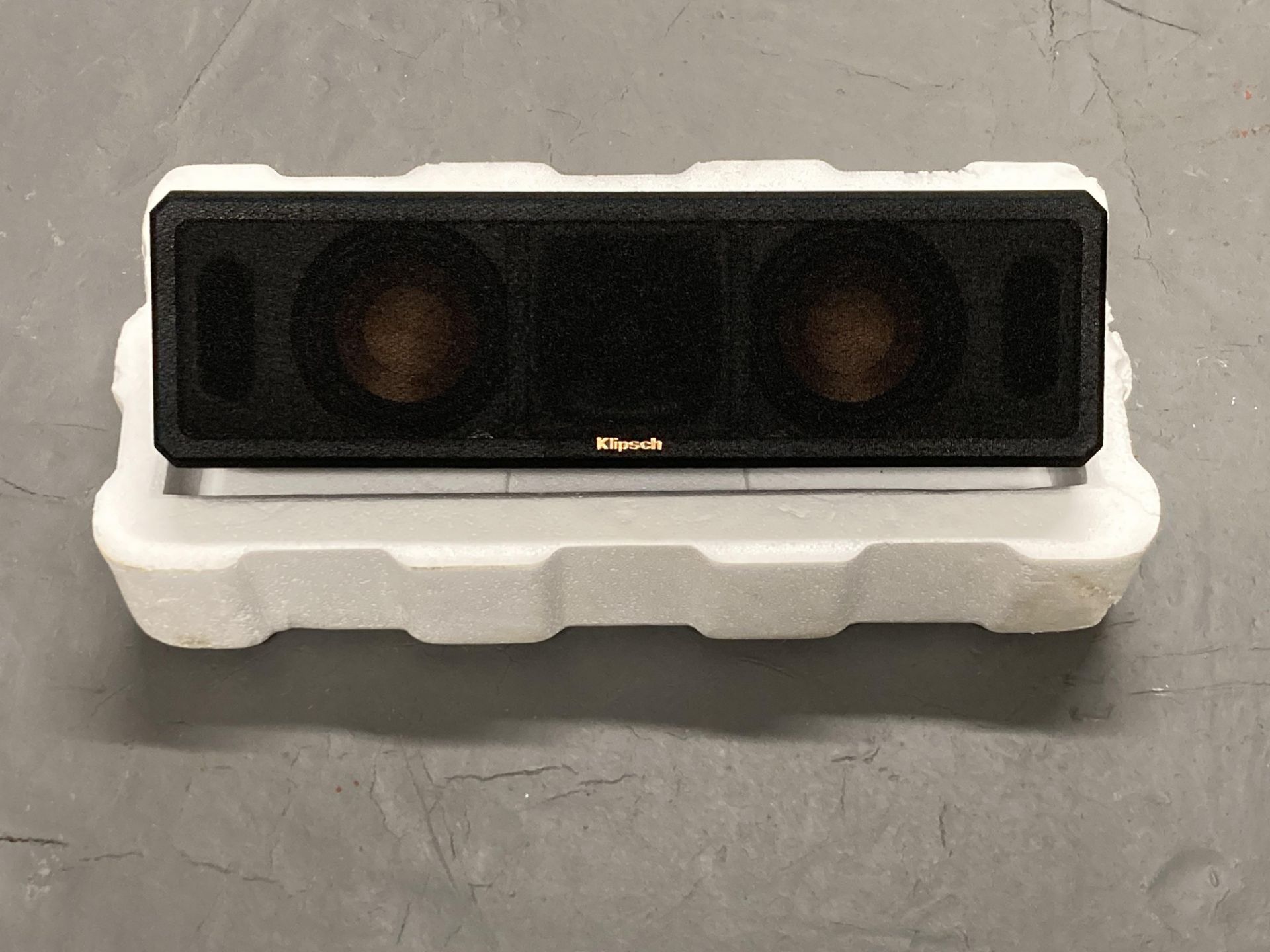 A klipsch - model RCSCEN audio speaker.