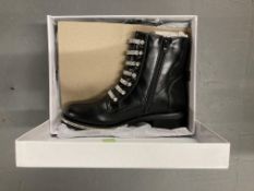 A carton of 12 pairs of black PU lady's shoes, sizes various.