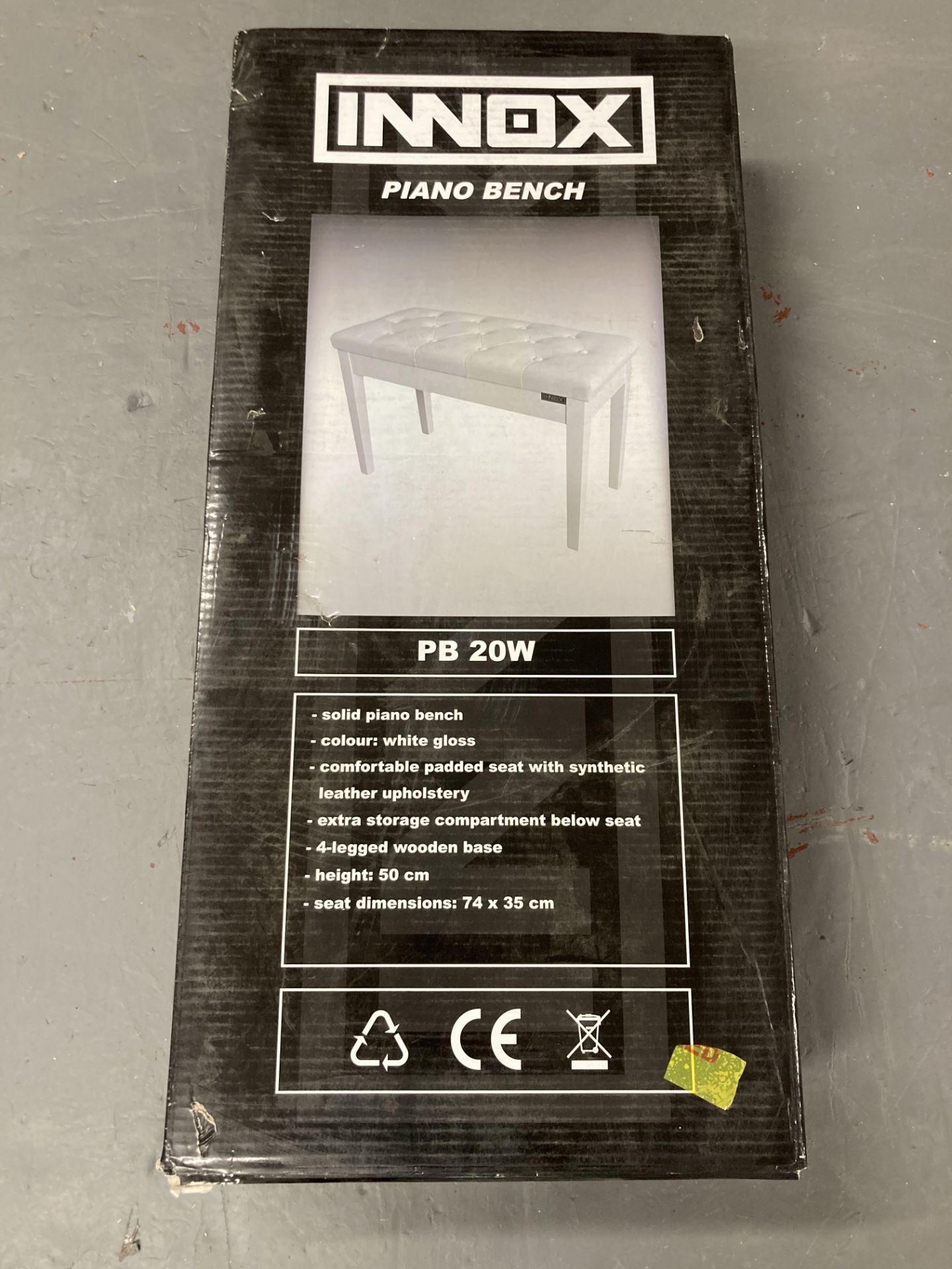 An Innox piano bench (boxed).