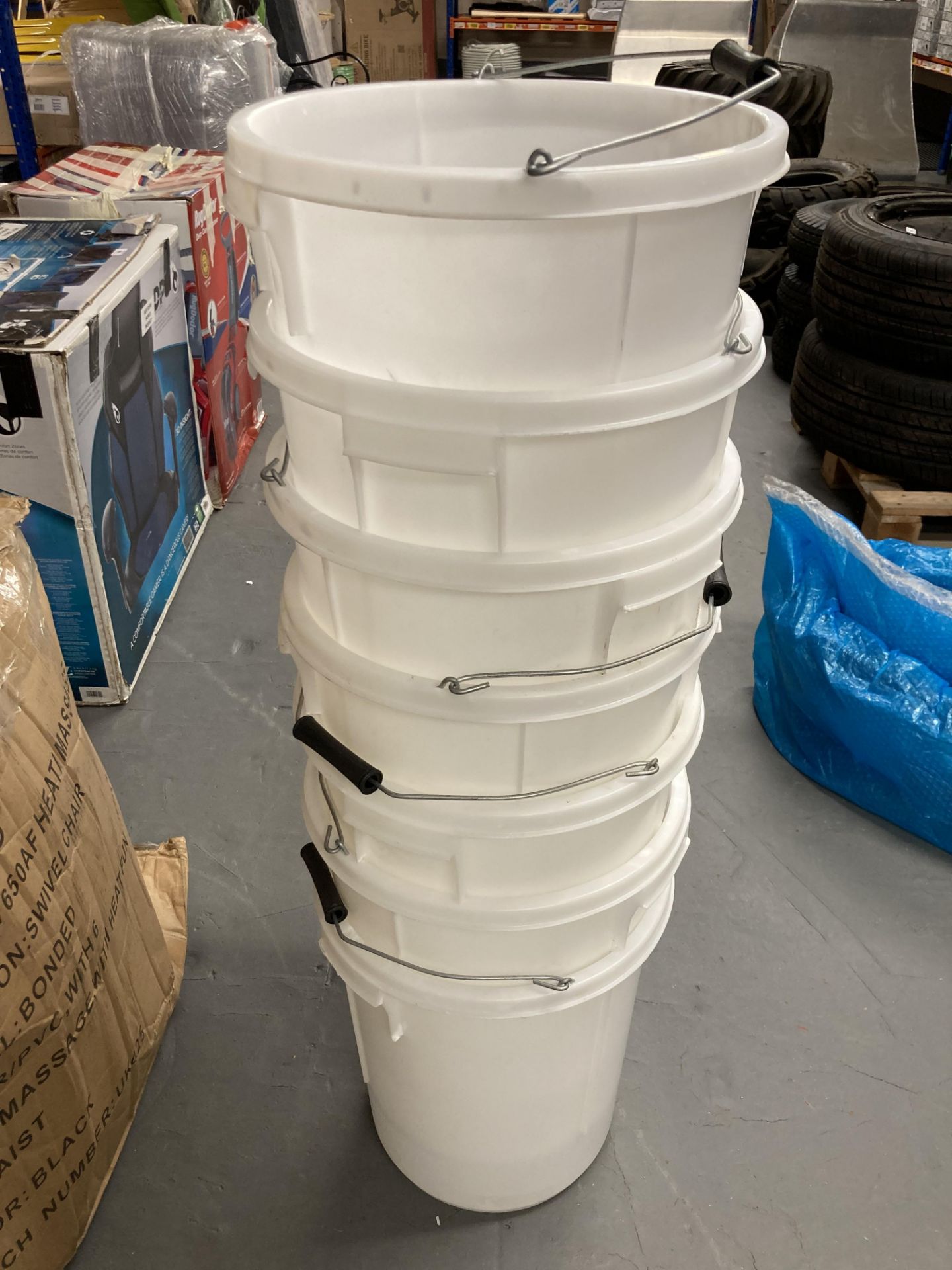 Seven white plastic buckets