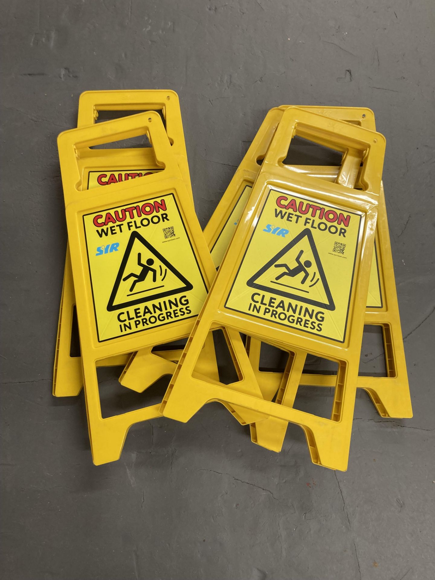 Ten caution cleaning in progress signs. CONDITION REPORT: One cracked.