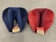 Sixteen Globe Trek International sculptured neck pillows,