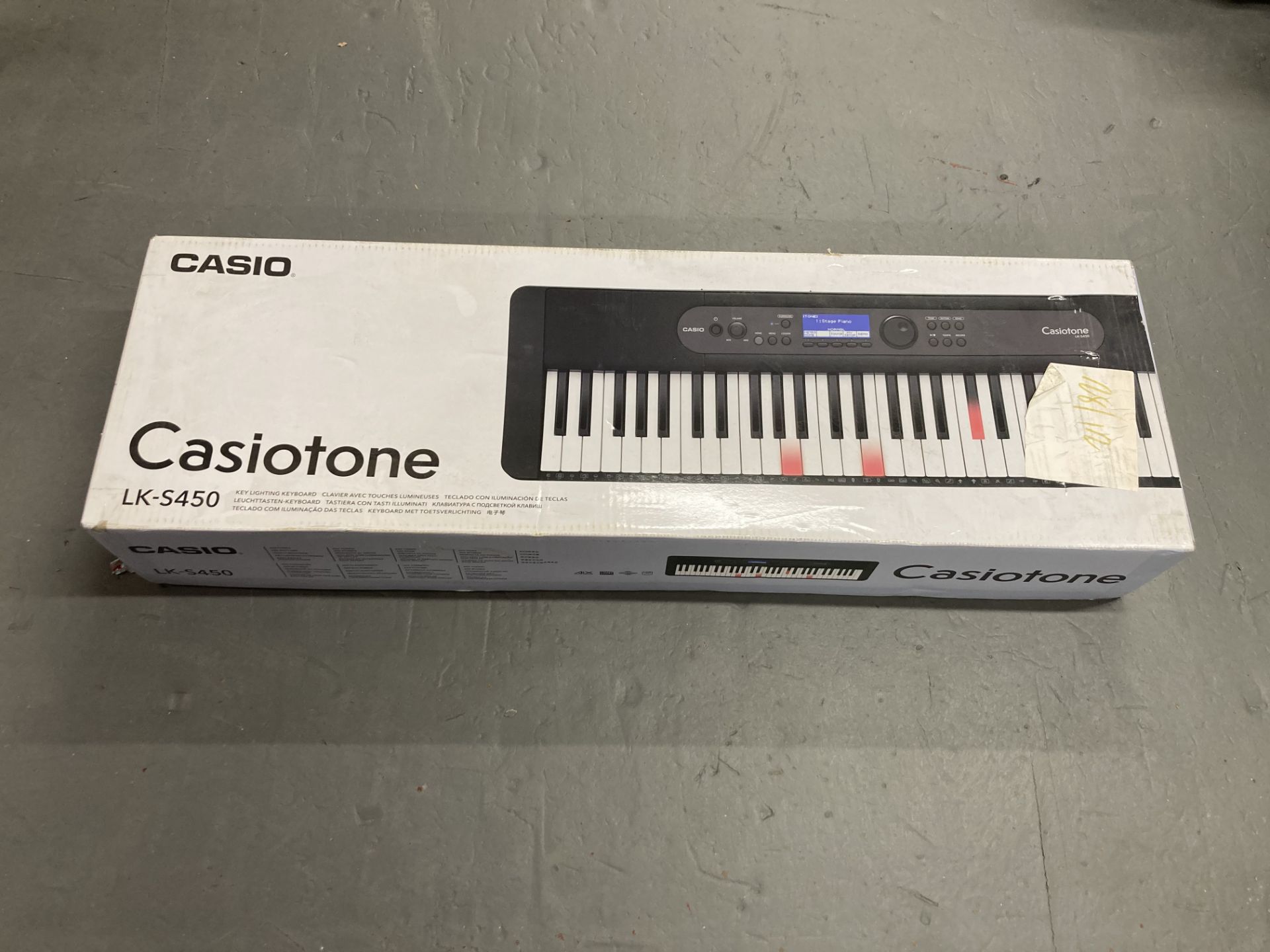 A Casiotone LK-S450 key lighted keyboard