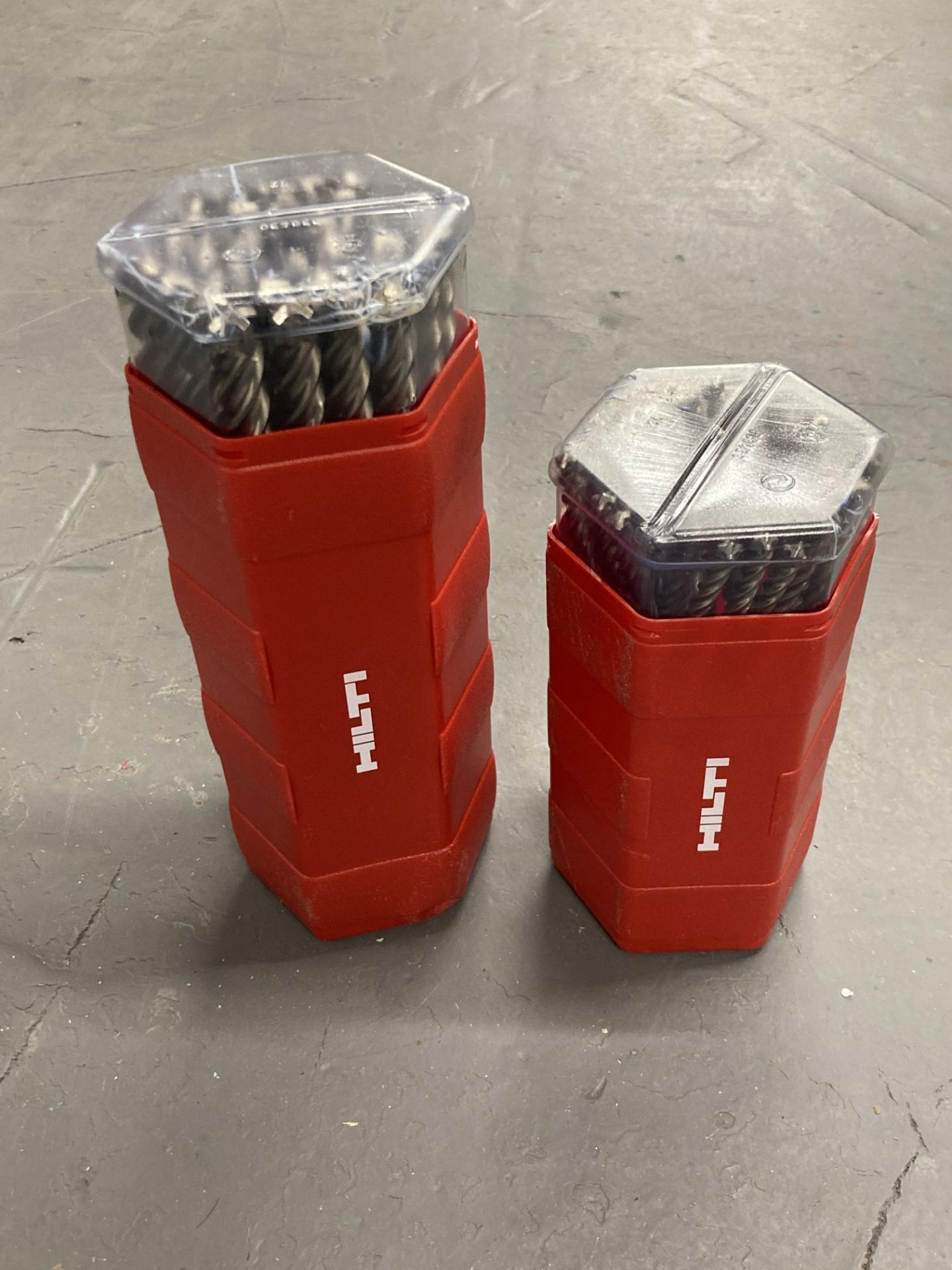 Two plastic cases of Hilti specialist drill bits.