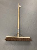 Two wooden stiff brush head brooms