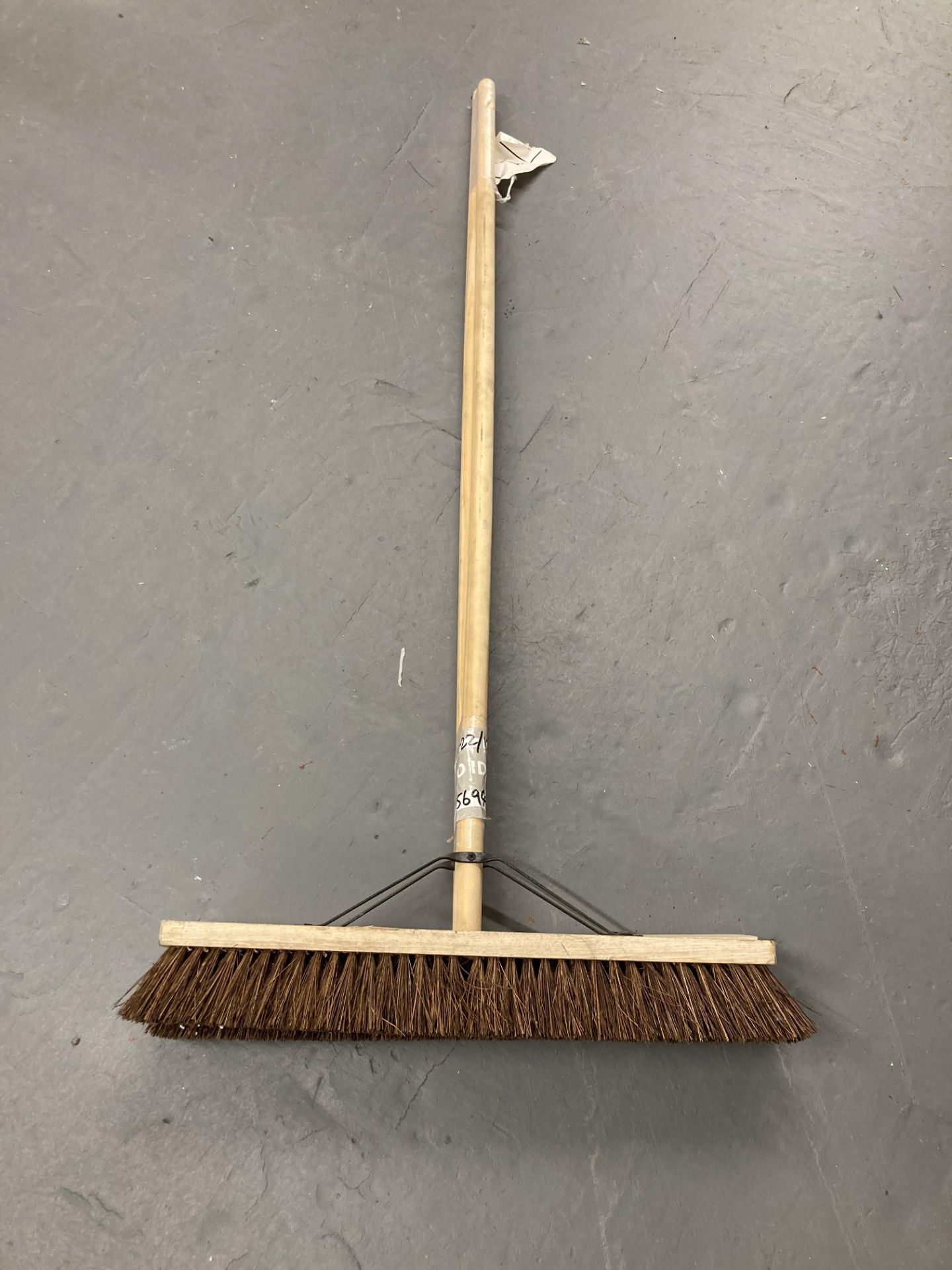 Two wooden stiff brush head brooms