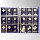 A Change Checker coin album containing fifty four collectable 50 pence coins,