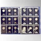 A Change Checker coin album containing fifty four collectable 50 pence coins,