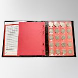 A Schulz coin album (red) containing eighty collectable 50 pence coins, various dates and themes.