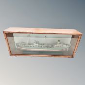 A scale model of a trawler in display case,