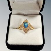 A boxed silver-gilt ring inset with blue stone