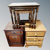An oak nest of tables together with a pine three drawer bedside stand and further small chest