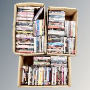 Three boxes of approximately 150 DVD's