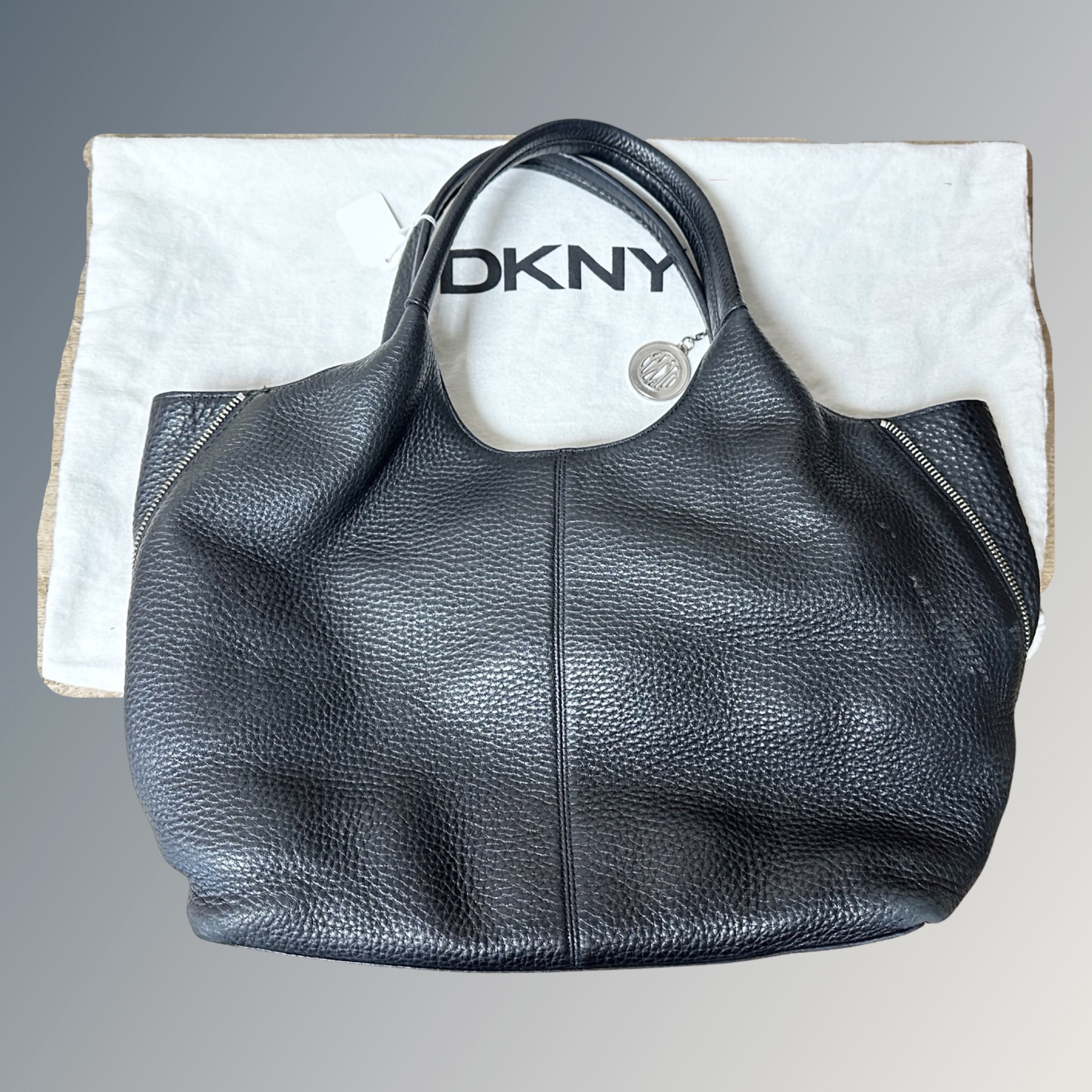 A DNKY black leather tote bag, 30 cm x 30 cm 15 cm,