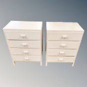 A pair of cream painted four drawer ply wood chests