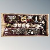 A box of mixed jewellery, enamelled necklace,