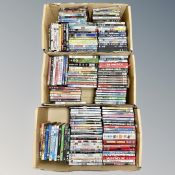 Three boxes containing approximately 150 DVD's