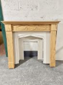 A three piece marble fire surround and a further pine surround