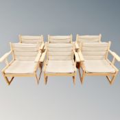 A set of six Scandinavian beech framed armchairs with canvas seats