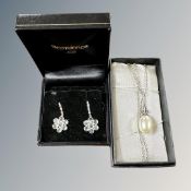 An elongated teardrop faux pearl on Art Deco silver setting and a boxed pair of silver earrings
