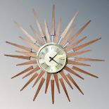 An Anstey & Wilson teak sunburst wall clock
