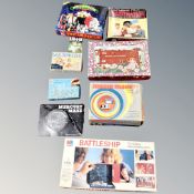 A box of boxed vintage record player, games, playing cards,