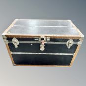 A studded vinyl steamer style shipping trunk,