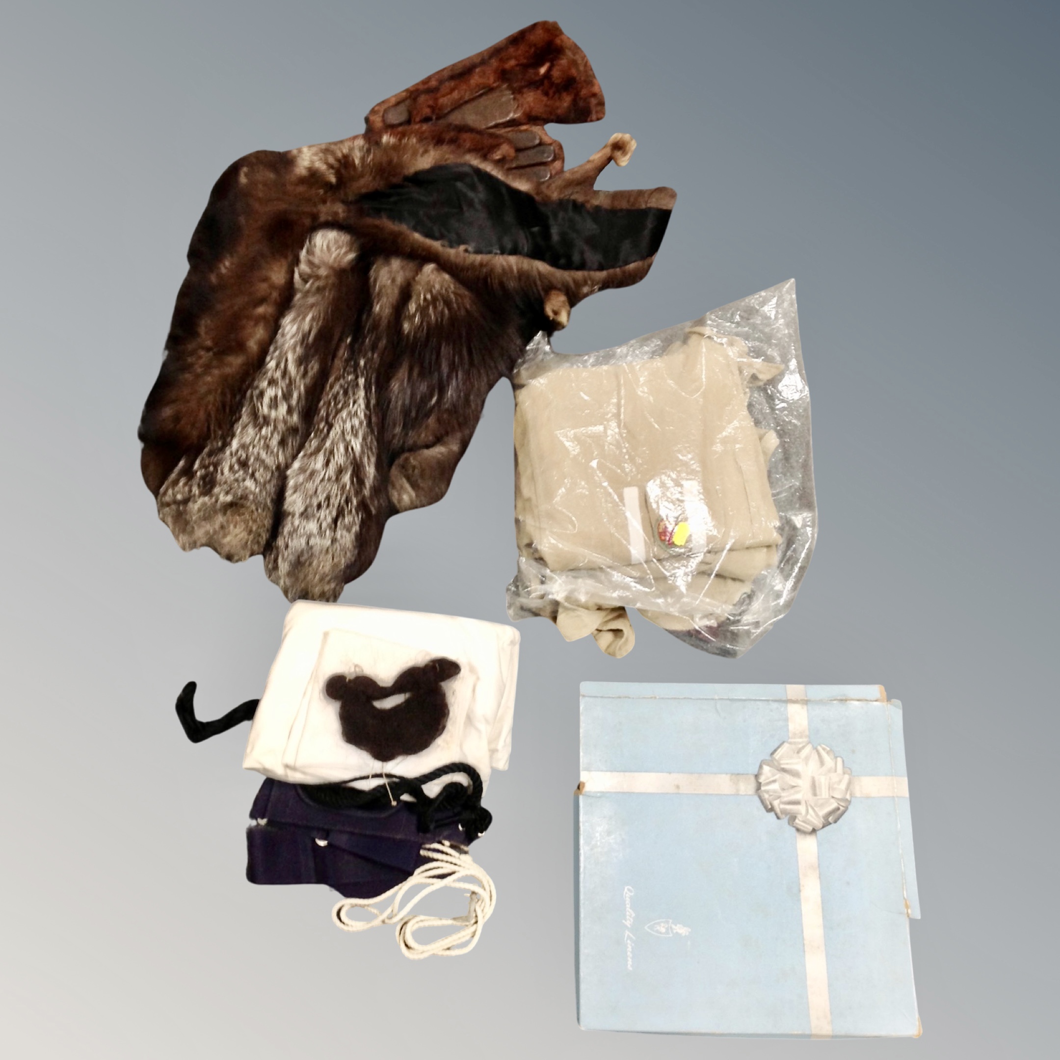 A box of fur stoles, gloves,