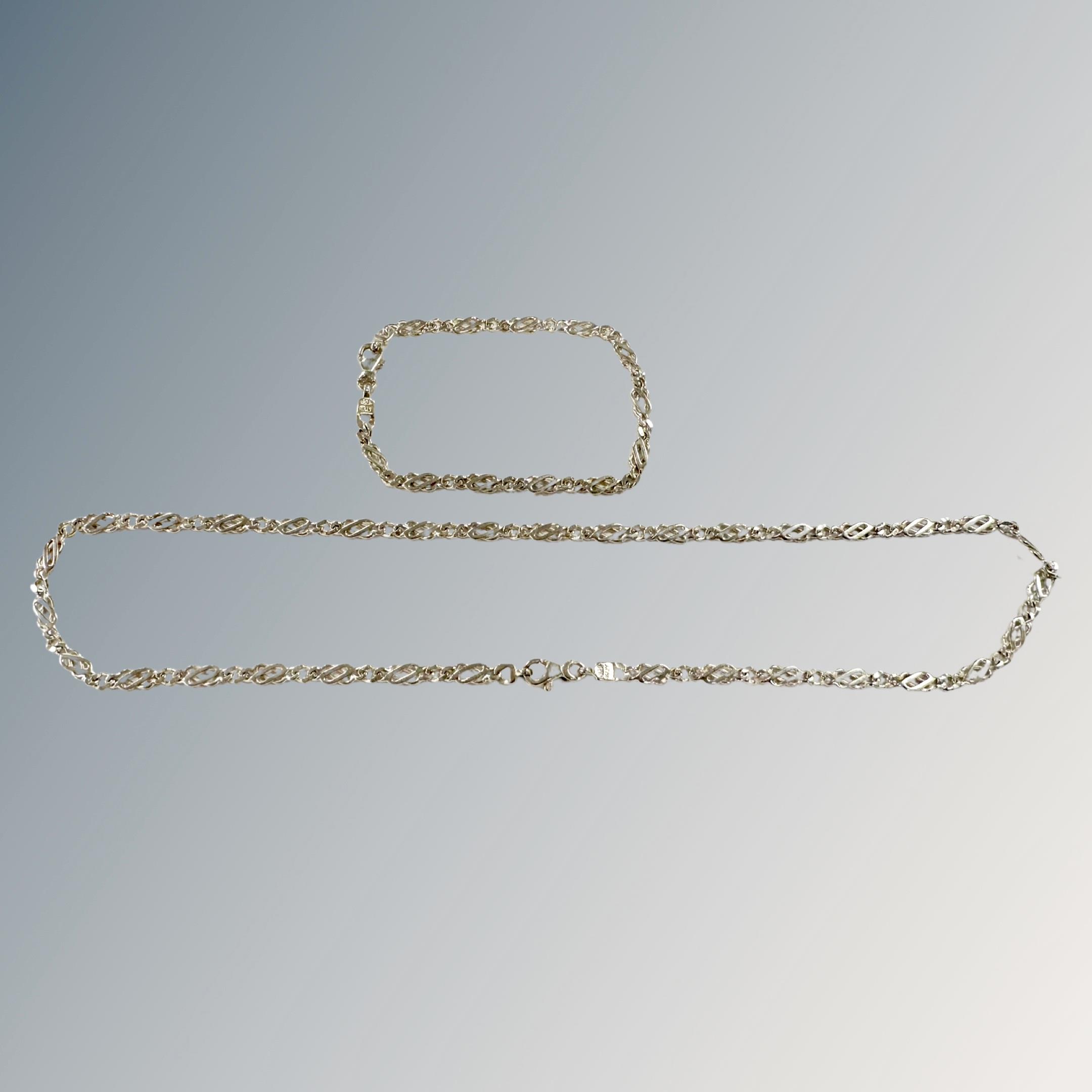 A silver chain and bracelet