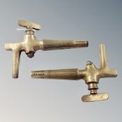 Two brass wine barrel faucets,