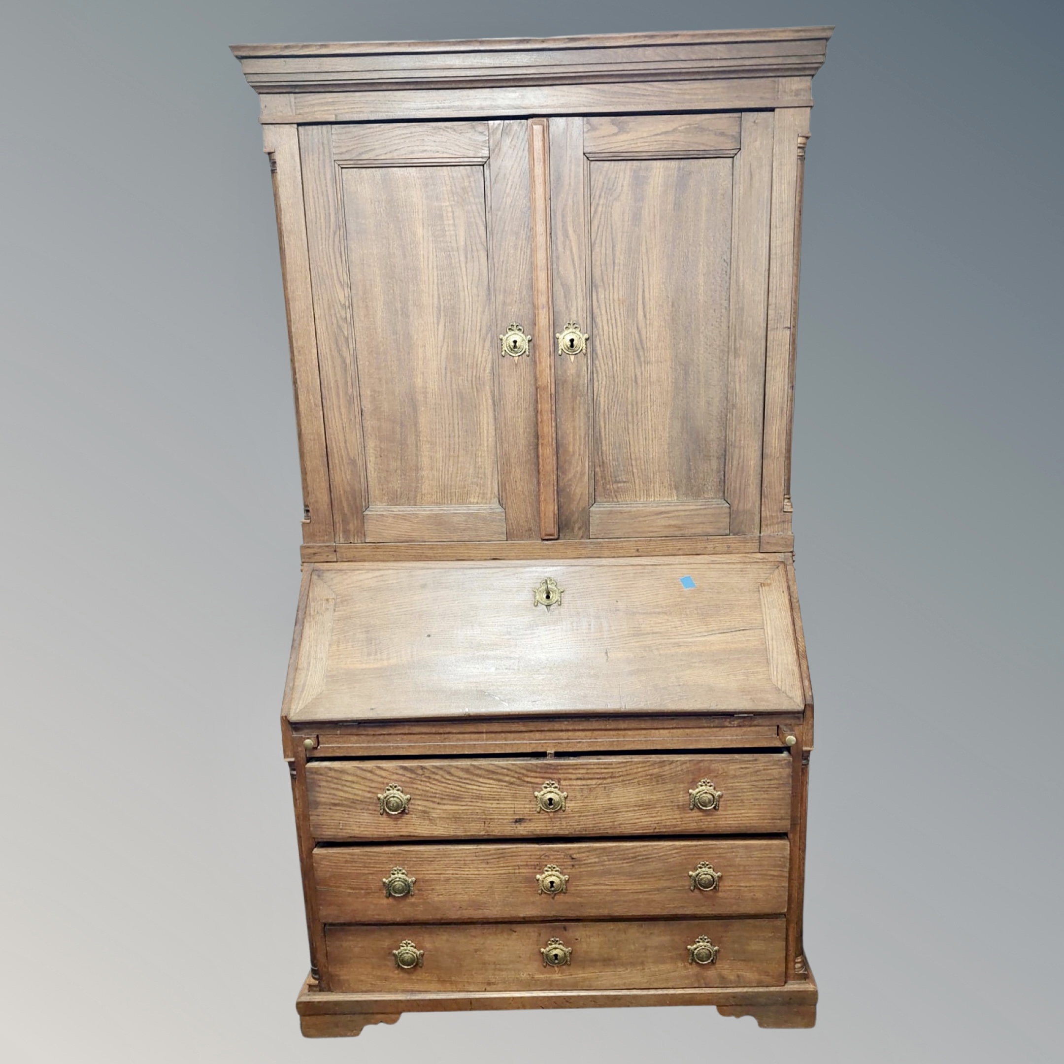 A 19th century Continental oak bureau bookcase,