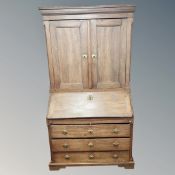 A 19th century Continental oak bureau bookcase,