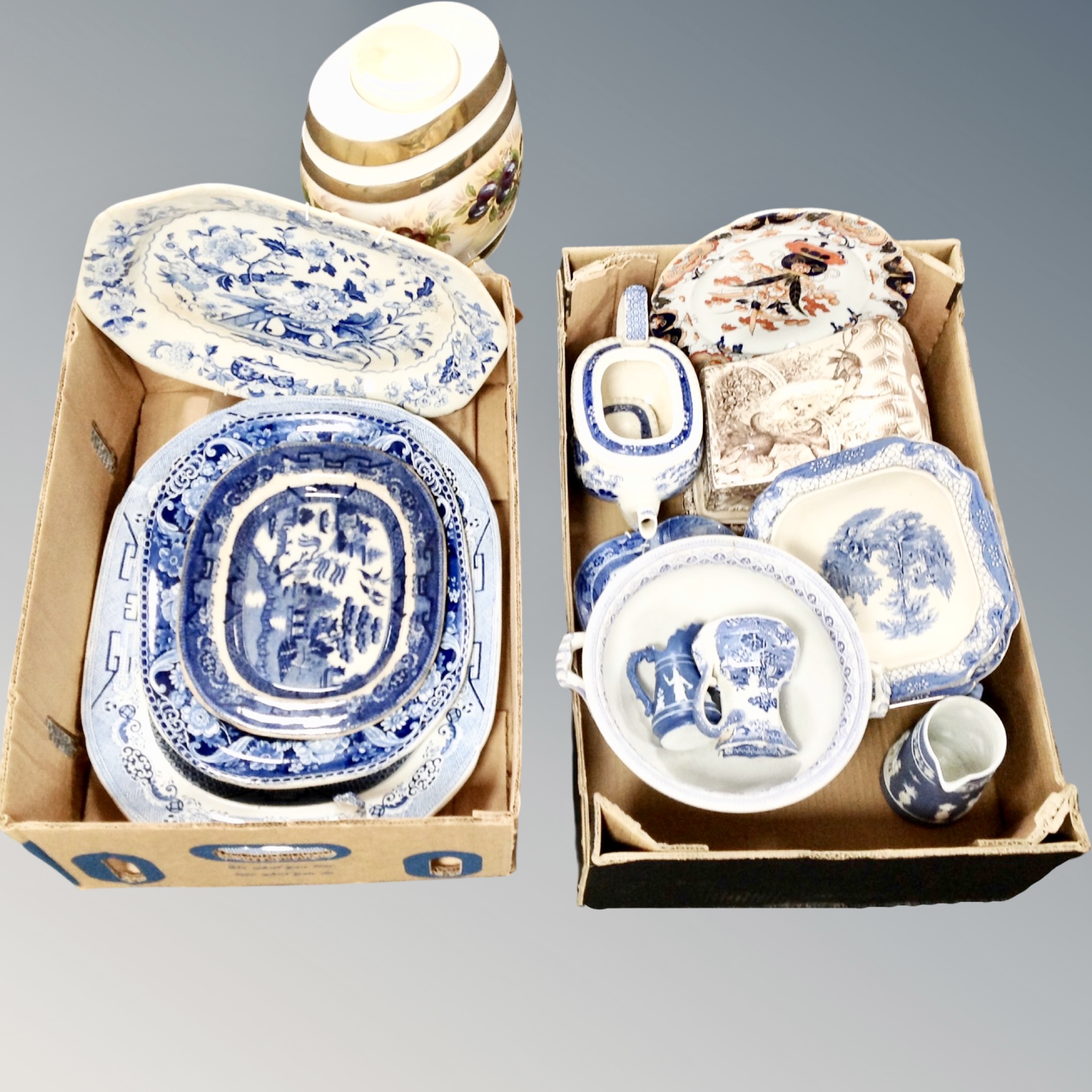 Two boxes of blue and white porcelain, ceramic barrel with tap,