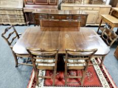 A mahogany dining room suite comprising of extending dining table with leaf,