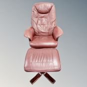 A stained beech and burgundy leather upholstered swivel armchair with footsool