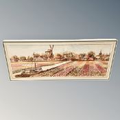 A large wool work picture depicting fields with village beyond,