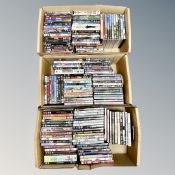 Three boxes containing approximately 150 DVD's
