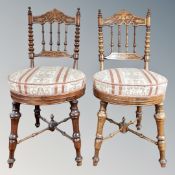 A pair of Edwardian beech poker work occasional chairs