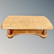 A heavy oak two tier coffee table,
