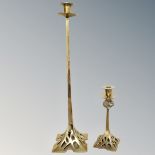 Two brass candlesticks in the Arts & Crafts style,
