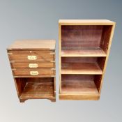 A campaign style brass mounted three drawer low chest together with a mahogany bookcase
