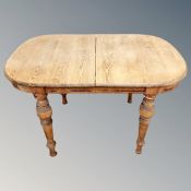 A 19th century pine D-end dining table