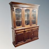 A Chapman's Siesta Victorian style triple door glazed bookcase fitted with cupboards, height 211 cm,