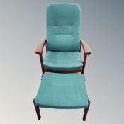 A Continental beech framed armchair in green fabric with matching footstool