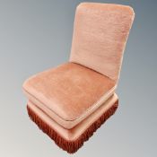 Two salon chairs in pink dralon upholstery