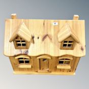 A contemporary pine doll's house