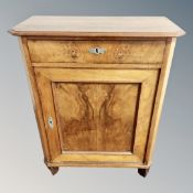 A 19th century walnut single door low cabinet,