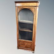 A continental walnut glazed bookcase,